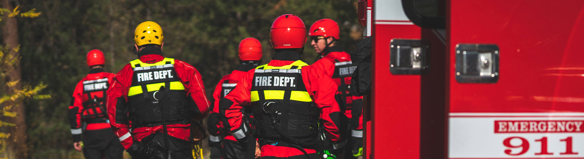 Fire fighters in red water gear out for training